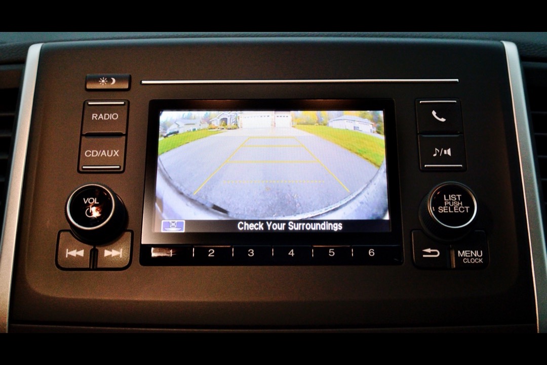 Rear-mounted backup camera on the tailgate of a modern vehicle
