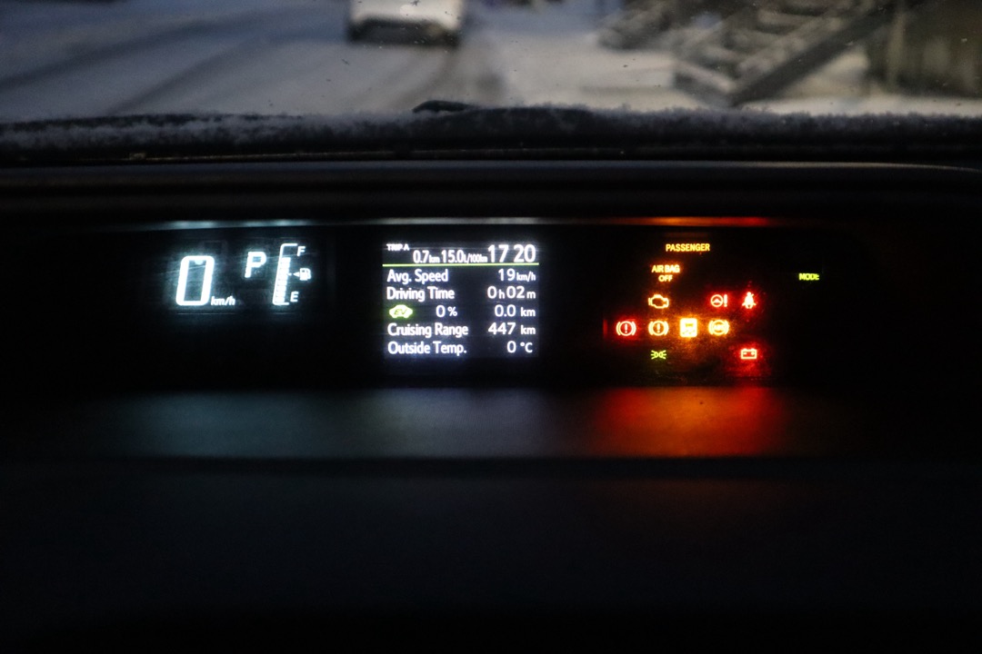 Car interior dashboard and center console being wiped clean with a microfiber cloth