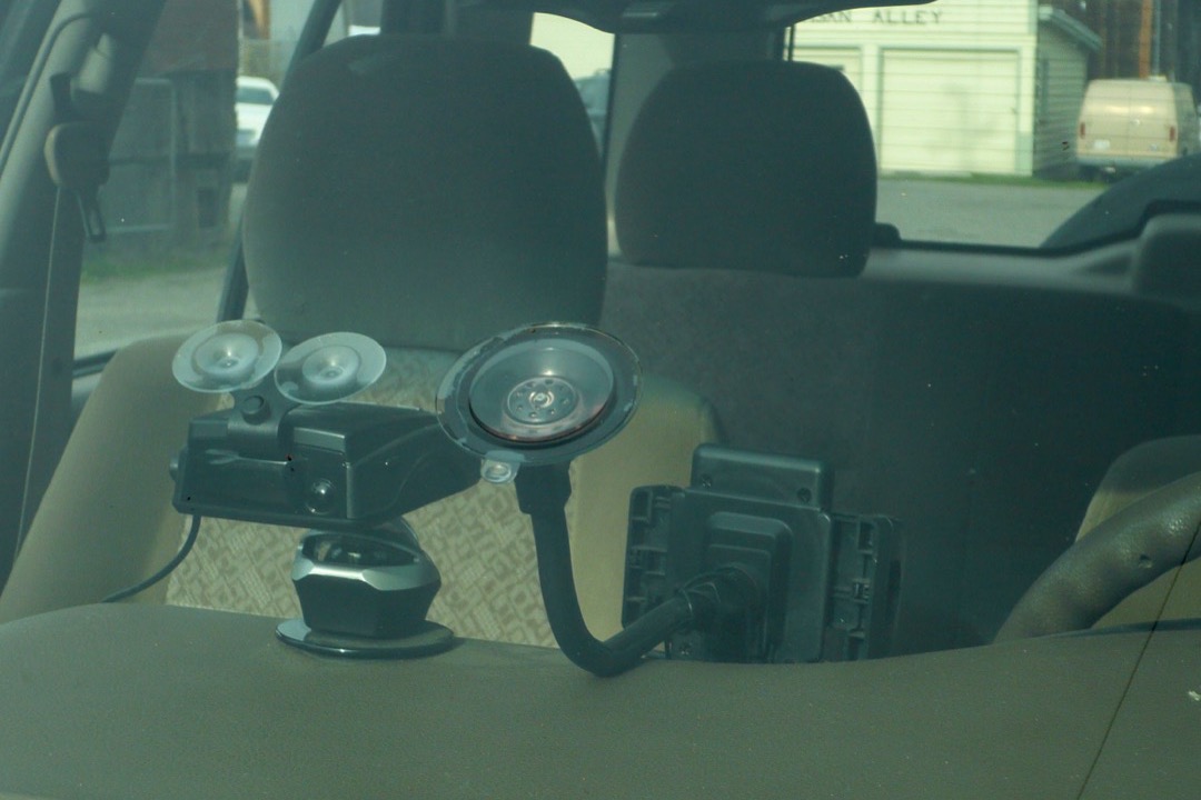 Dash cam mounted on a car windshield recording the road ahead